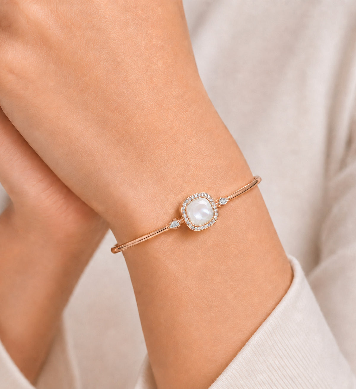 Relic Aura Bangle in pearl white styled on wrist