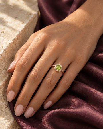 Green stone effect ring styled in warm sunlight