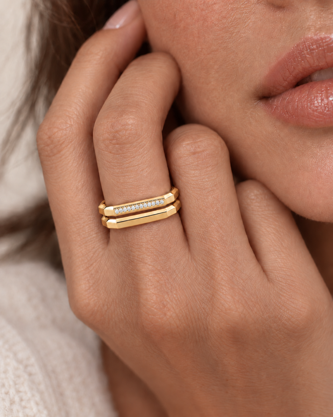 AMBECA gold-tone Mosaic pave and plain stacking rings worn together on a model's hand, styling view