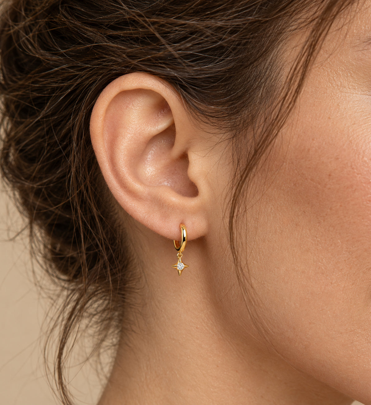 Aster Star Charm Huggie Earrings (Gold), model styling view