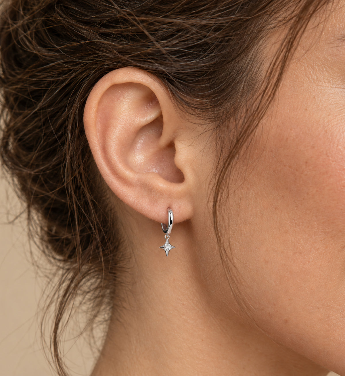 Aster Star Charm Huggie Earrings (Silver), model styling view