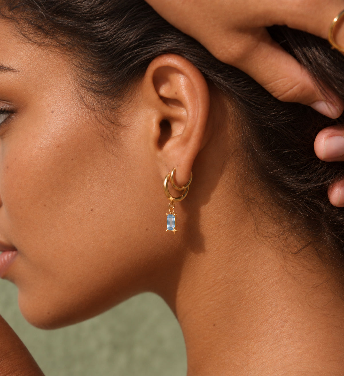 Caelum Blue Rectangle Star Drop Earrings in Gold, model styling view 1
