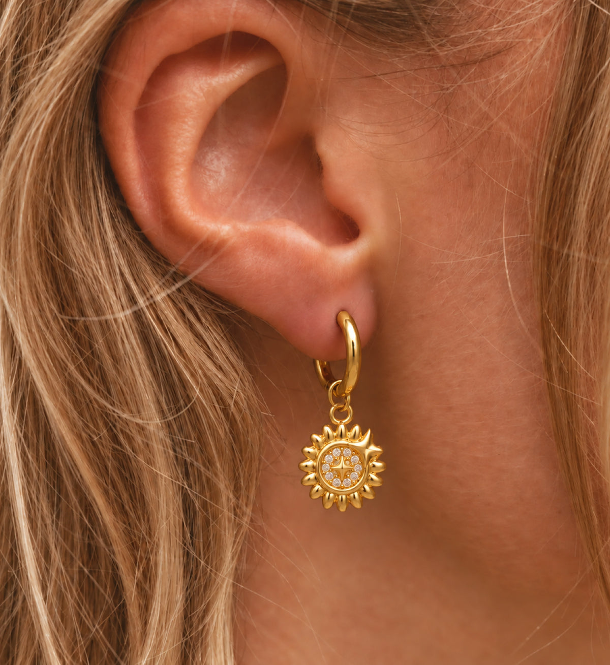 Elyra Sunburst Medallion Hoop Earrings in Gold, model styling view 1