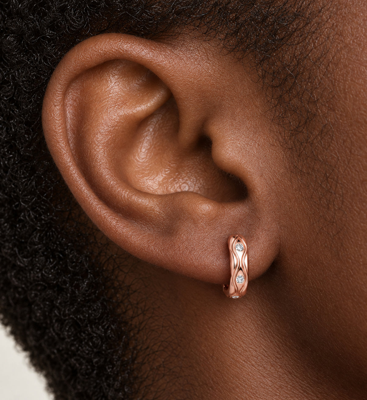 Marea Sculpted Wave Huggie Earrings (Rose Gold), model styling view