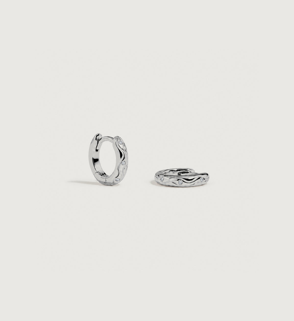Marea Sculpted Wave Huggie Earrings (Silver)
