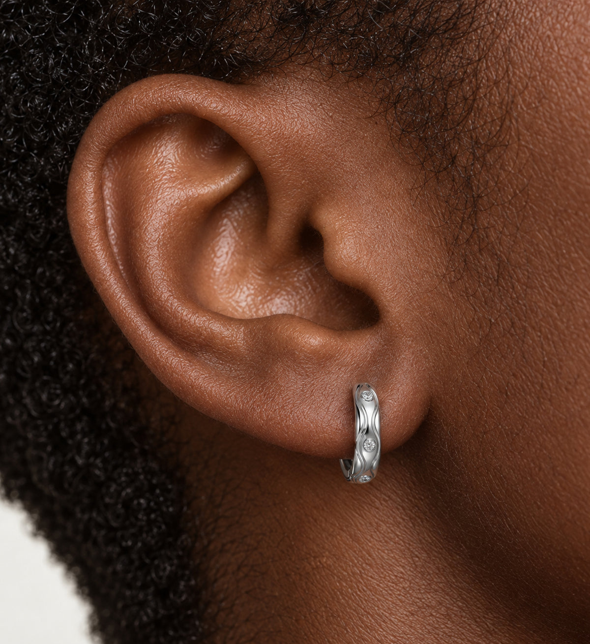 Marea Sculpted Wave Huggie Earrings (Silver), model styling view
