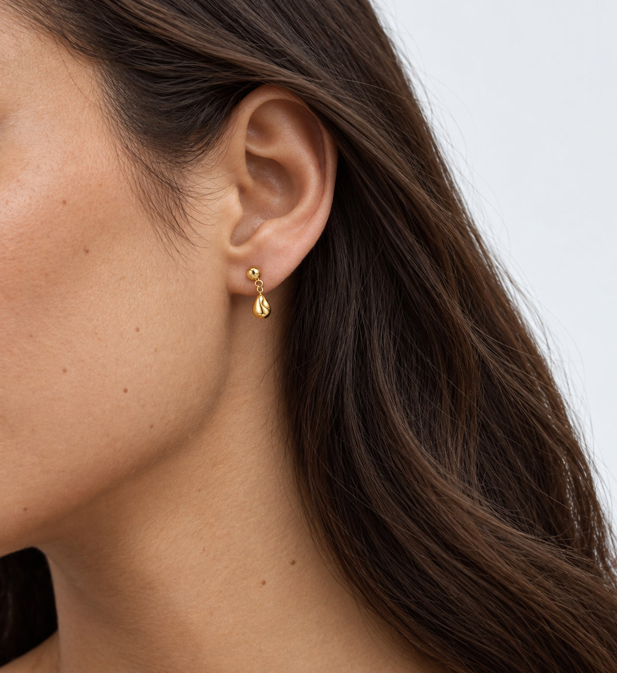 Neris Sculpted Teardrop Earrings (Gold), model styling view