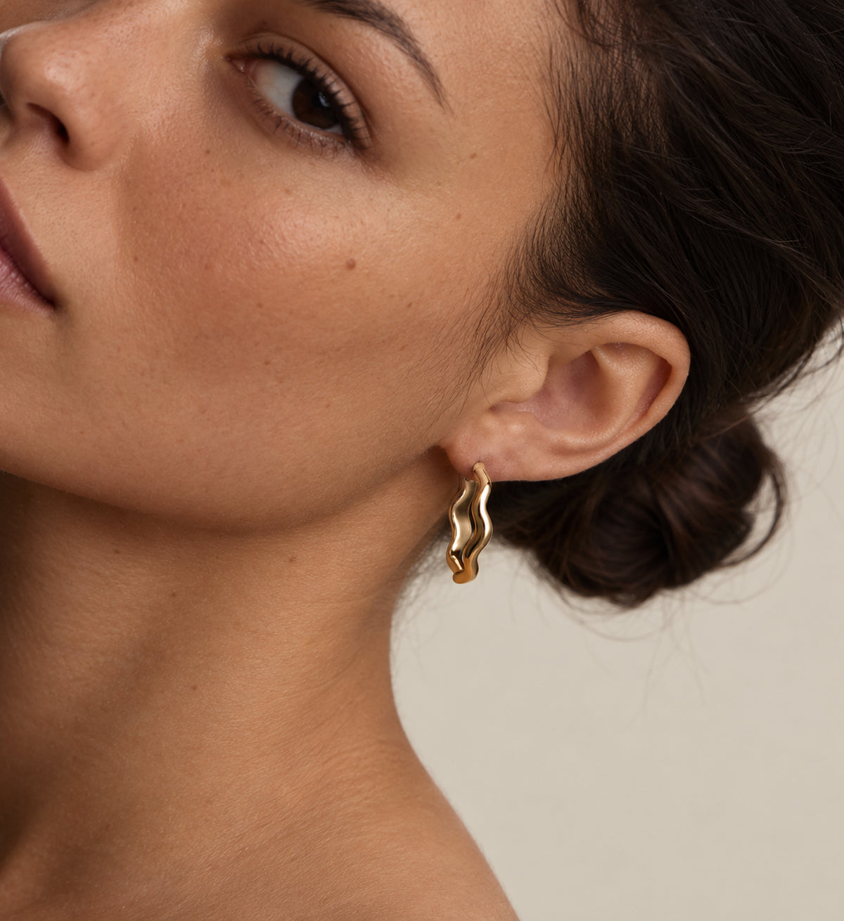 Noma Double-Wave Hoop Earrings (Gold), model styling view