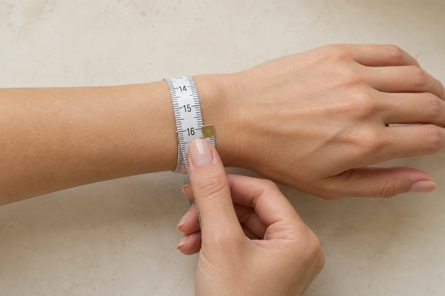 Wrap a soft measuring tape snugly around the wrist where the bracelet will sit